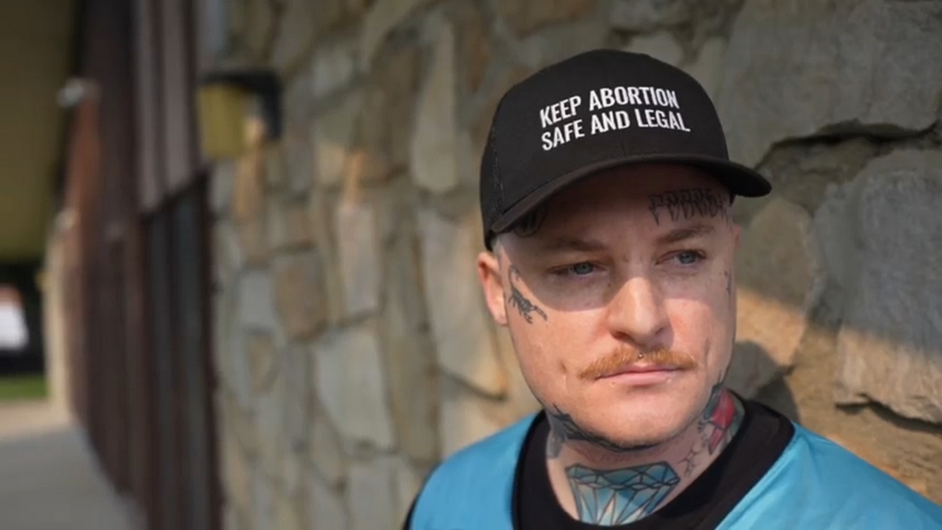 No One Walks Alone: Clinic Escorts Block Anti-Abortion Protesters